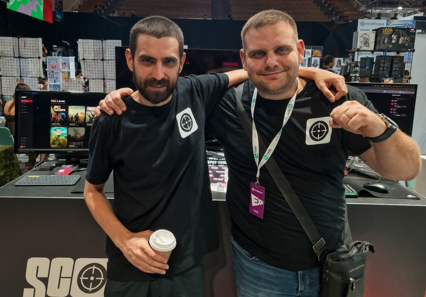 The two Scoped founders in Scoped T-shirts, arms around each other at the Scoped booth at EPICENTER 2026